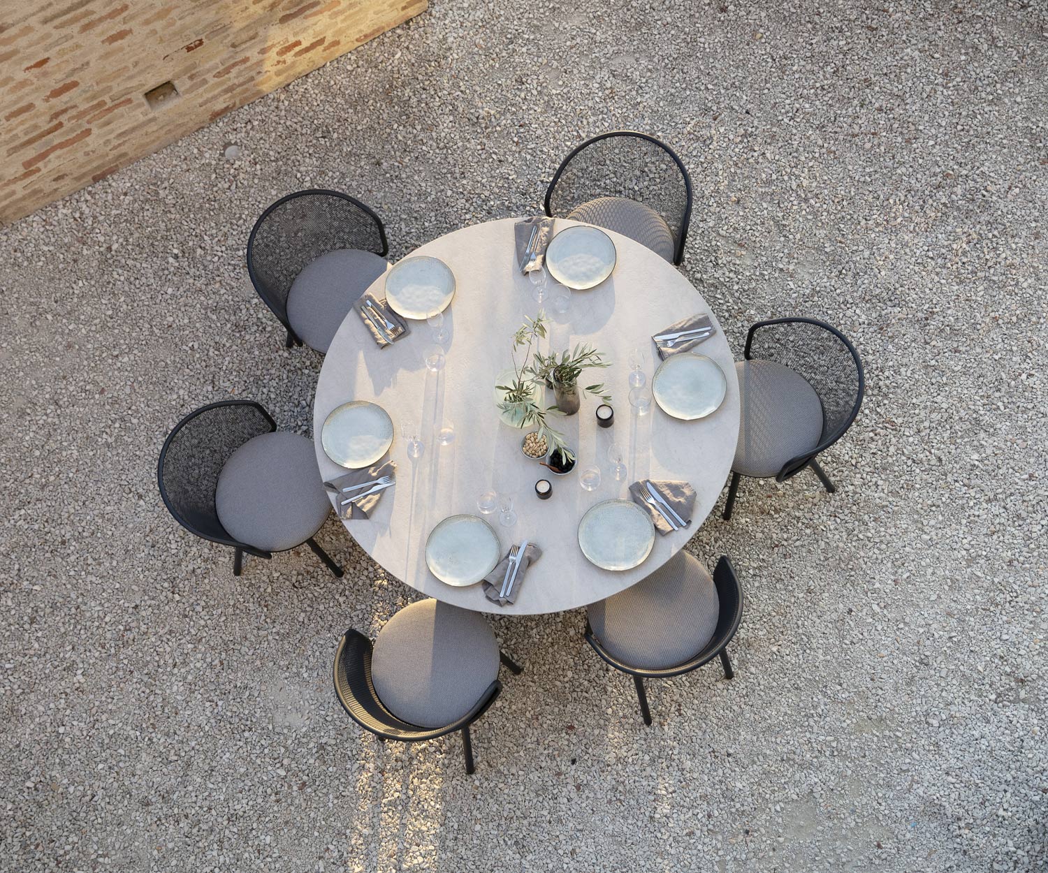 Exclusive Todus Branta Design round dining table by the swimming pool on the terrace