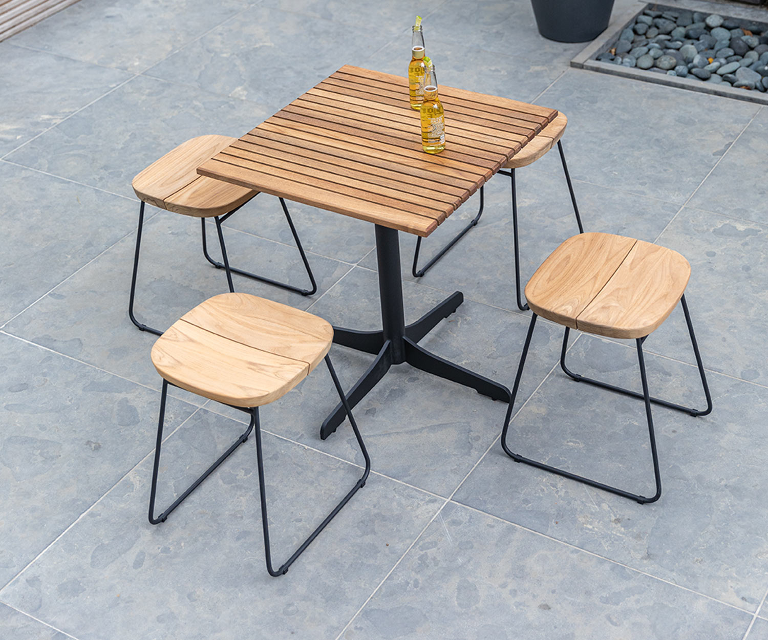 Weatherproof Oasiq Bryggen design bar stool with garden table on balcony