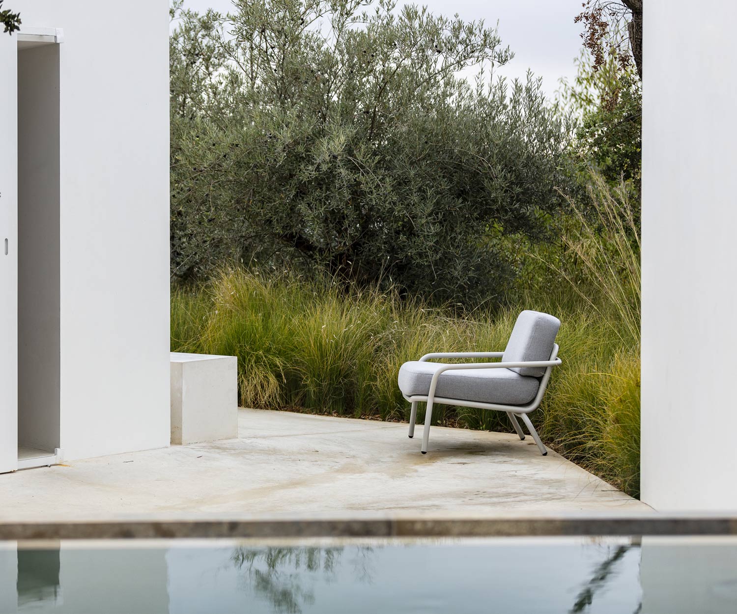 Todus Starling designer outdoor armchair on garden terrace