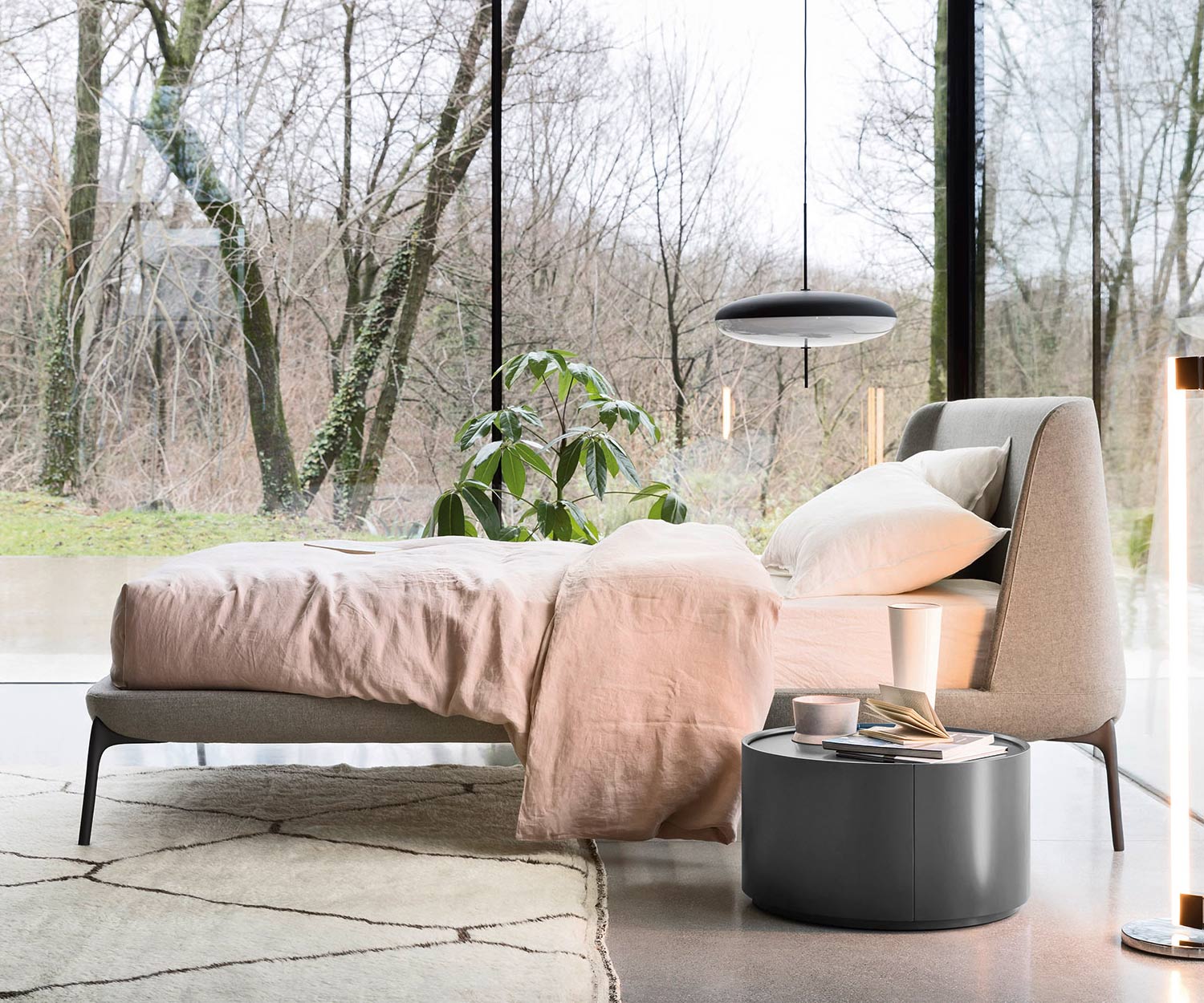 Round designer side table Allout from Novamobili in the bedroom