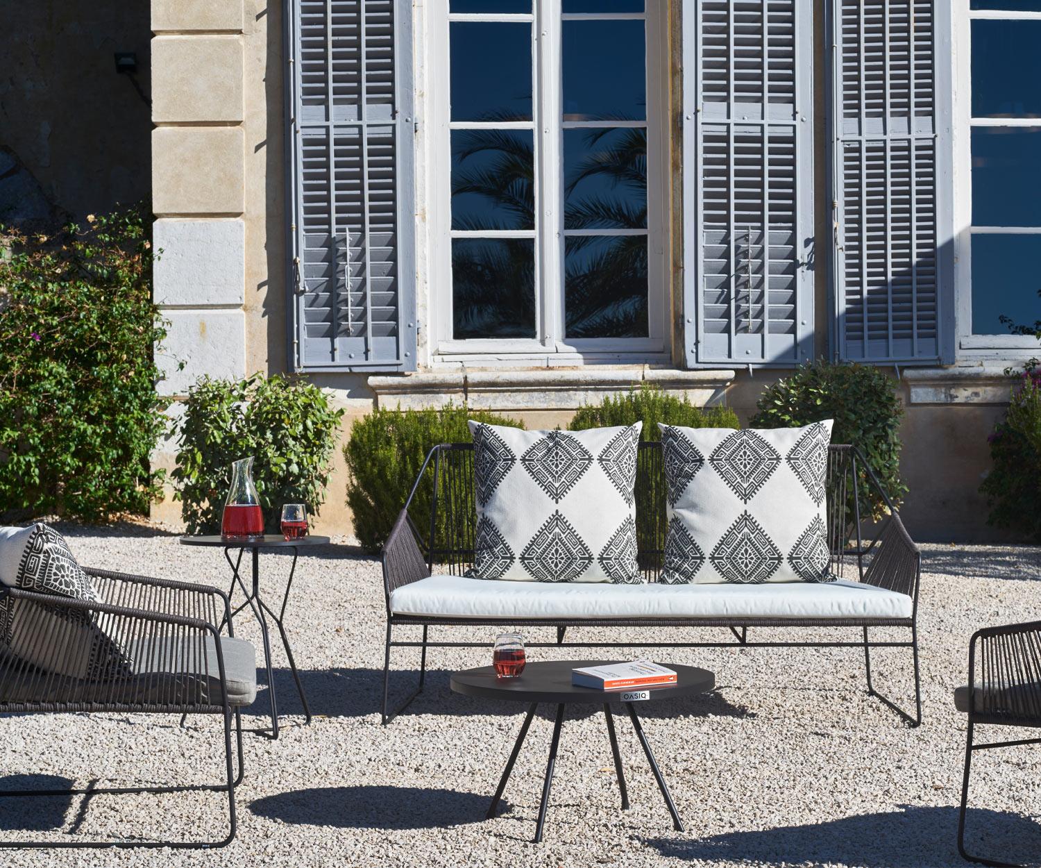 Oasiq Attol Design side table in dark grey gravel terrace garden